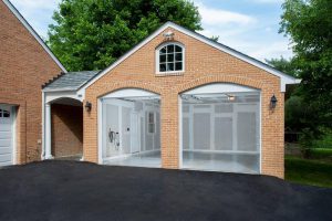 brick garage home addition with blut skies